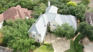 large home with new silver metal roof